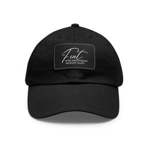 May include: Black baseball cap with a white patch that says "Fiat mihi secundum verbum tuum".