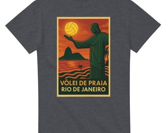 May include: Dark gray t-shirt featuring a graphic of Christ the Redeemer statue holding a volleyball, with a sunset backdrop. The text "VÔLEI DE PRAIA RIO DE JANEIRO" is displayed below the image.