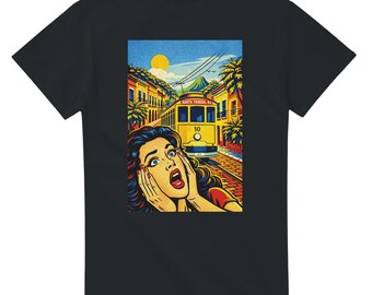 May include: Black t-shirt featuring a pop art style graphic. The graphic depicts a woman with wide eyes and an open mouth, with a yellow trolley car in the background. The trolley car has the number 10 on it.