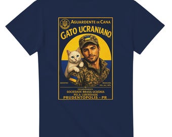 May include: Navy blue t-shirt featuring a graphic of a man with a cat, and text in yellow and white. The text reads "AGUARDENTE DE CANA GATO UCRANIANO". The image has a yellow and blue background, and the text "SOCIEDADE BRASIL-UCRÂNIA PELA LIBERDADE PRUDENTÓPOLIS - PR".