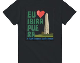 May include: Black t-shirt featuring a graphic design with the text "EU IBI PUE RA" in green, a red heart, and a depiction of a monument. Below the monument is the text "O PULMÃO VERDE DE SÃO PAULO".