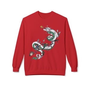 May include: Red sweatshirt featuring a detailed illustration of a white dragon with green and black accents, surrounded by various cartoon characters. The dragon is the central focus, with the characters positioned along its body. The sweatshirt has long sleeves and a crew neck.