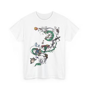 May include: White t-shirt featuring a colorful illustration of a dragon with characters from a popular animated film. The design includes a green and white dragon, with various figures and creatures. The shirt is made of a soft, comfortable material.