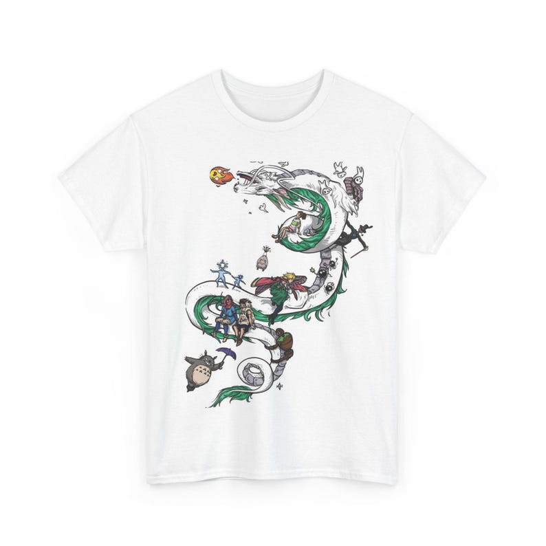 May include: White t-shirt featuring a colorful illustration of a dragon with characters from a popular animated film. The design includes a green and white dragon, with various figures and creatures. The shirt is made of a soft, comfortable material.