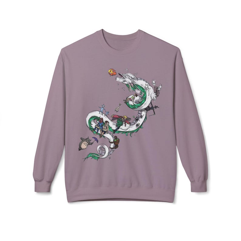 May include: A mauve long-sleeve sweatshirt featuring a detailed graphic of a white dragon with green accents, carrying various animated characters. The design includes a variety of colorful figures and objects, creating a whimsical and detailed scene.