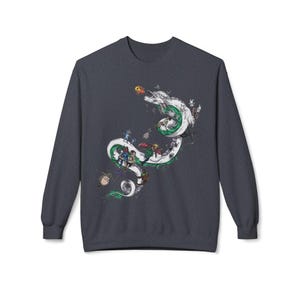May include: Dark gray sweatshirt featuring a detailed illustration of a white dragon with green accents, carrying various animated characters. The design includes a variety of colorful elements and figures, creating a whimsical and artistic aesthetic.