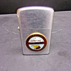 NOS Unfired Penguin Lighter USS Zelima AF 49 We Feed the Fleet