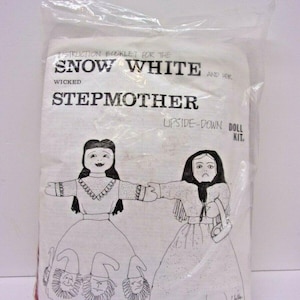 May include: A white fabric doll kit in a clear plastic bag. The kit features a black and white illustration of Snow White and her stepmother. Text on the package reads "Snow White and Her Wicked Stepmother Upside-Down Doll Kit."