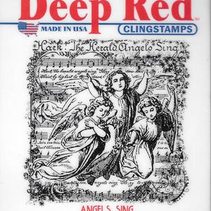 May include: A white card with a red "Deep Red" logo and the words "Clingstamps" and "Made in USA". The card features a black and white image of three angels singing with musical notes and the text "Hark! The Herald Angels Sing". The card also includes the text "Angels Sing" and the SKU number "4X505111".