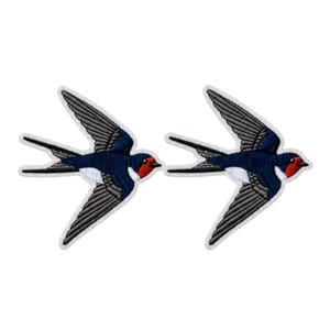 May include: Two identical embroidered swallow patches featuring dark blue wings with grey detailing, a white underbelly, and a red throat patch. Each bird is depicted in a flying position with wings extended and a long, forked tail.
