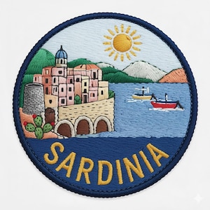 May include: A circular embroidered patch featuring a coastal scene with a cluster of buildings, a stone tower, and a cactus on the left. The sea contains two small boats, and the sky has a yellow sun. The word SARDINIA is stitched in yellow.