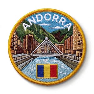 May include: Embroidered patch featuring a scenic view of Andorra, with the word "ANDORRA" in white letters on a blue background. The design includes a bridge, river, mountains, buildings, and the Andorra flag. The patch has a yellow border.