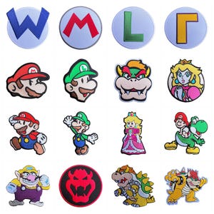 May include: A collection of sixteen embroidered patches featuring various video game characters and symbols, including Mario, Luigi, Princess Peach, Bowser, and Wario, alongside circular patches with the letters W, M, L, and a Bowser emblem.