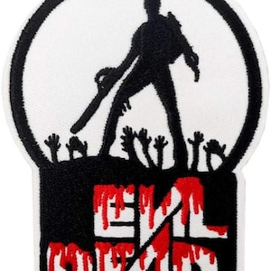 May include: An embroidered patch featuring a black silhouette of a figure holding a chainsaw standing above reaching hands within a circular border. Below, the text EVIL DEAD is displayed in white block letters with red dripping paint effects.