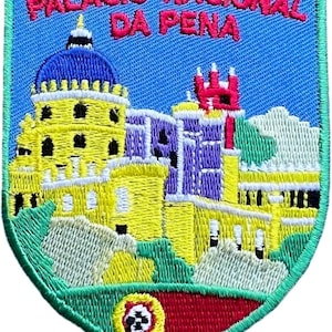 May include: A shield-shaped embroidered patch featuring the Palácio Nacional da Pena in yellow, blue, and purple against a light blue sky. The text PALÁCIO NACIONAL DA PENA is stitched in pink at the top, with a small Portuguese crest at the bottom.