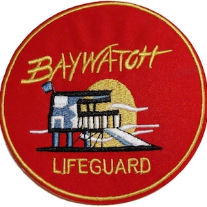 May include: A circular embroidered patch with a red background and a gold border. It features the yellow text BAYWATCH above a graphic of a lifeguard tower and a yellow sun. The word LIFEGUARD is embroidered in yellow text at the bottom.