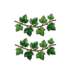 May include: Two identical embroidered patches featuring a brown vine branch with multiple green ivy leaves. Each patch displays a horizontal arrangement of foliage with varying shades of green, showcasing detailed stitching and a pointed leaf shape.