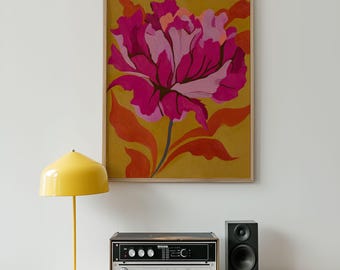 May include: A framed floral art print featuring a large, stylized flower in shades of pink and magenta against a mustard yellow background. The artwork includes orange and red leaves. The print is displayed above a stereo system and a yellow floor lamp.