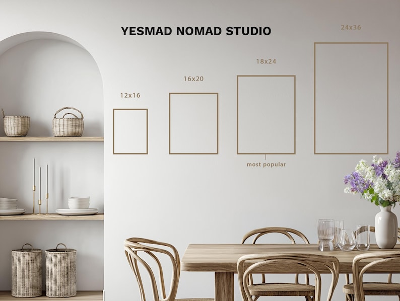 May include: A wall with framed art prints in various sizes, including 12x16, 16x20, 18x24, and 24x36 inches. The text "YESMAD NOMAD STUDIO" is at the top. The scene includes a dining table, chairs, and decorative elements.
