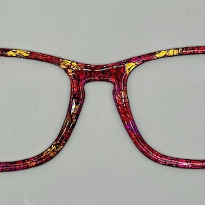 May include: A set of three ceramic mugs with a speckled, matte finish. Each mug features a different color: light blue, cream, and gray. The mugs have a simple, modern design and a comfortable handle.