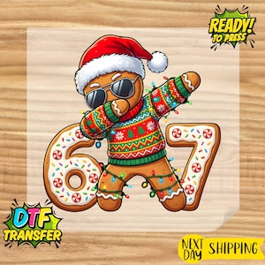 May include: A DTF transfer featuring a gingerbread man wearing sunglasses and a Santa hat, dabbing. The gingerbread man is wearing a Christmas sweater and is decorated with colorful lights. The numbers 6 and 7 are also present.