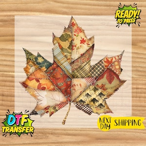 May include: A colorful maple leaf design, composed of various fabric patterns, including floral and plaid, in shades of orange, red, and green. The leaf is set against a light background with the text "READY! TO PRESS" and "DTF TRANSFER".