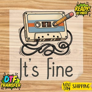May include: A retro cassette tape illustration with a pencil inserted, and the words "It's fine" in a playful font. The design includes a black cord and the words "Ready to Press" and "DTF Transfer".