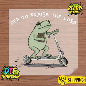 May include: A light green frog riding a white scooter, holding a book with a cross. The text "OFF TO PRAISE THE LORD" is arched above the frog. The image also includes "READY! TO PRESS" and "DTF TRANSFER" text.