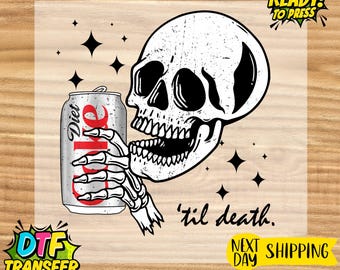 May include: A black and white graphic featuring a skull holding a Diet Coke can. The can is silver with red text. The phrase "'til death" is written below the skull. Black star shapes are scattered around the design.