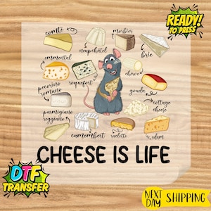 May include: A colorful graphic featuring various cheeses, a cartoon rat, and the phrase "CHEESE IS LIFE." Cheese varieties include Comte, Morbier, Brie, Gouda, and more. The image also includes the text "READY TO PRESS" and "DTF TRANSFER."