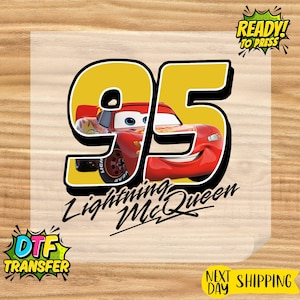 May include: A DTF transfer featuring Lightning McQueen from the Cars movie. The design includes the number 95 in yellow with a red race car, and the text "Lightning McQueen". The image also includes the text "Ready to Press".