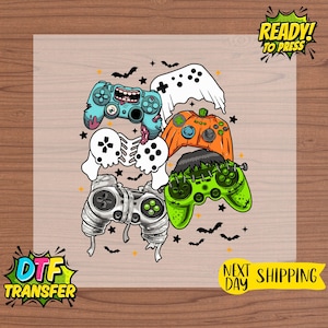 May include: A DTF transfer featuring a collection of Halloween-themed video game controllers. The controllers are designed as a ghost, pumpkin, Frankenstein, and skeleton. The image includes the text "READY! TO PRESS" and "NEXT DAY SHIPPING".