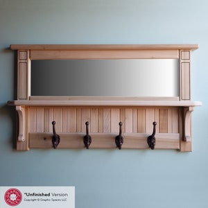May include: Unfinished wood coat rack with a mirror and four hooks. The rack has a shelf above the hooks and a decorative trim around the mirror.