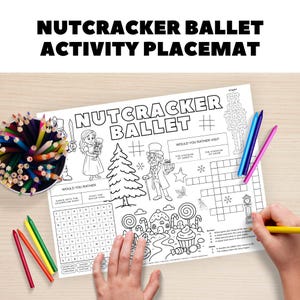 May include: A black and white Nutcracker Ballet activity placemat with illustrations of characters and scenes from the ballet. The placemat includes a word search, crossword puzzle, and maze. Colored pencils and crayons are visible.