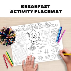May include: A white breakfast activity placemat with the text "BREAKFAST ACTIVITY PLACEMAT" and "IT'S TIME FOR AN EGG-CELLENT MORNING". The placemat features a cartoon egg, crossword, maze, and other activities.