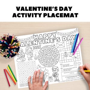 May include: A Valentine's Day activity placemat with the text "VALENTINE'S DAY ACTIVITY PLACEMAT" at the top. The placemat features a maze, word search, and other activities. A hand is holding a yellow pencil, coloring the placemat.