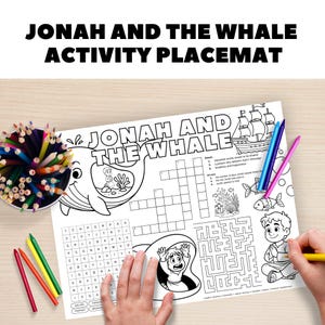 Op de afbeelding: Een zwart-witte activiteit placemat met de tekst "JONAH AND THE WHALE ACTIVITY PLACEMAT". De placemat bevat illustraties van een walvis, een schip en een doolhof, samen met een kruiswoordpuzzel en een woordzoeker.