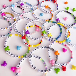 May include: A set of three ceramic mugs with a speckled, matte finish. The mugs are in shades of cream, light gray, and dark gray. Each mug has a simple, minimalist design, perfect for coffee or tea.