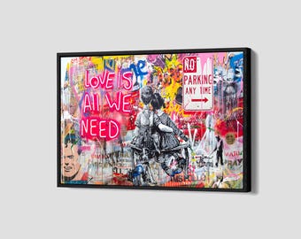 May include: Framed artwork with graffiti-style art. The words "LOVE IS ALL WE NEED" are in bright pink neon. The image features two children, a "No Parking Any Time" sign, and various colorful tags and illustrations.