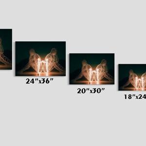 May include: Canvas art prints featuring a glowing sculpture of two figures embracing a central light source. Available in various sizes, including 30"x45", 24"x36", 20"x30", 18"x24", and 12"x18". The artwork has a dark green background.
