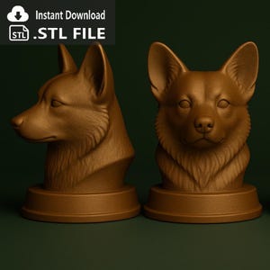 May include: Two brown corgi dog busts, one in profile and one facing forward, each on a circular base. The busts have detailed fur textures and are set against a dark green background. Text in the upper left corner reads "Instant Download .STL FILE".