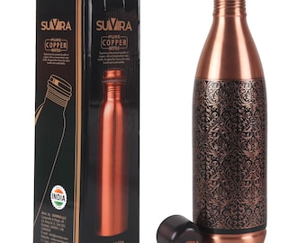 May include: A copper water bottle with an intricate floral design, a black cap, and a matching box. The bottle is made of pure copper and has a sleek, modern design. The box features the brand name "SUVIRA" and the words "PURE COPPER BOTTLE".