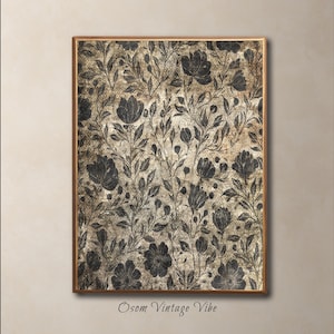May include: A framed floral print with a vintage aesthetic. The artwork features a repeating pattern of dark gray flowers and foliage against a textured, tan background. The frame is a warm brown color, and the text "Osom Vintage Vibe" is at the bottom.