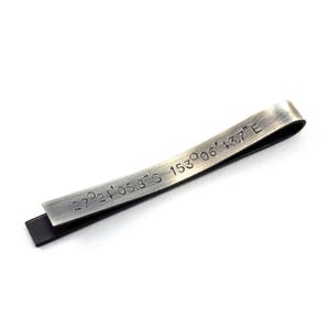 Back of the tie clip is shown personalised with GPS coordinates. Perfect for adding a unique, personal touch to your outfit or gift that is not visible to anyone but the wearer. The text on the back of the tie clip will be hidden from view when worn.