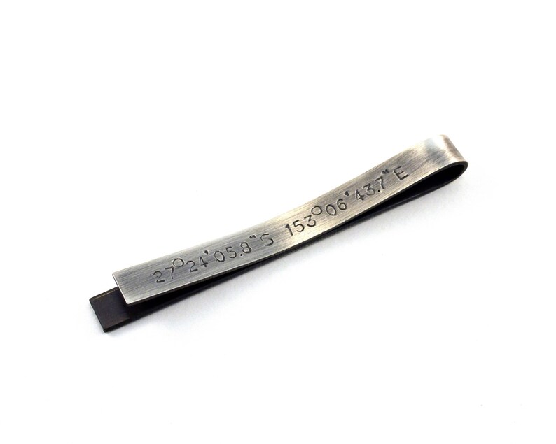 Back of the tie clip is shown personalised with GPS coordinates. Perfect for adding a unique, personal touch to your outfit or gift that is not visible to anyone but the wearer. The text on the back of the tie clip will be hidden from view when worn.