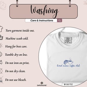 May include: White crew neck sweatshirt with the text "tired moms coffee club" in blue, along with a blue croissant and coffee cup graphic. The image also includes washing instructions and the word "Washing".