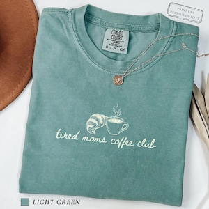 Modern mom shirt with simple tired moms coffee club text and clean coffee themed artwork