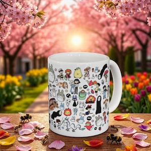 Cute forest spirit mug inspired by Studio Ghibli featuring adorable Kodama and whimsical nature characters. Aesthetic anime coffee mug inspired by My Neighbor Totoro, Princess Mononoke, and Spirited Away with charming woodland illustration design.