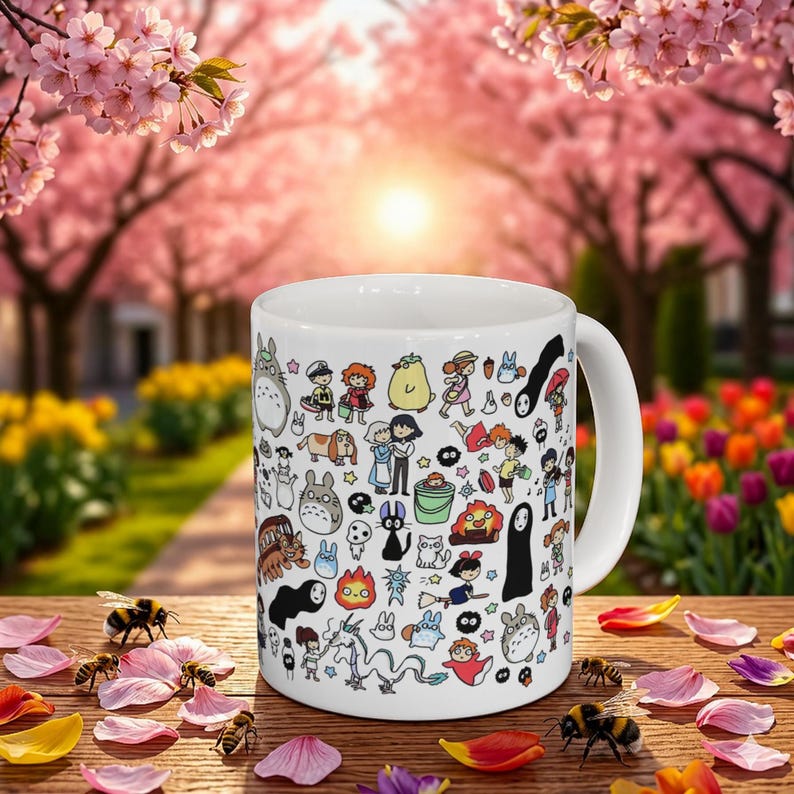 Cute forest spirit mug inspired by Studio Ghibli featuring adorable Kodama and whimsical nature characters. Aesthetic anime coffee mug inspired by My Neighbor Totoro, Princess Mononoke, and Spirited Away with charming woodland illustration design.