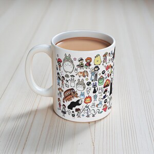 Cute anime mug gift idea inspired by the enchanting forest creatures seen in My Neighbor Totoro and Princess Mononoke. Perfect coffee mug for fans of Studio Ghibli style animation.